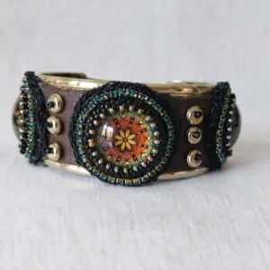 Rigid bracelet with metal and synthetic leather band. Skillaly artisanal product, Made in Italy.