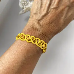 Yellow cotton thread bracelet with matching beads. Authentic Skillaly product, Made in Italy.